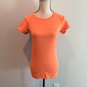 Lululemon Orange Short Sleeve Swiftly 2.0 Hip Length Shirt Top Women’s size 6